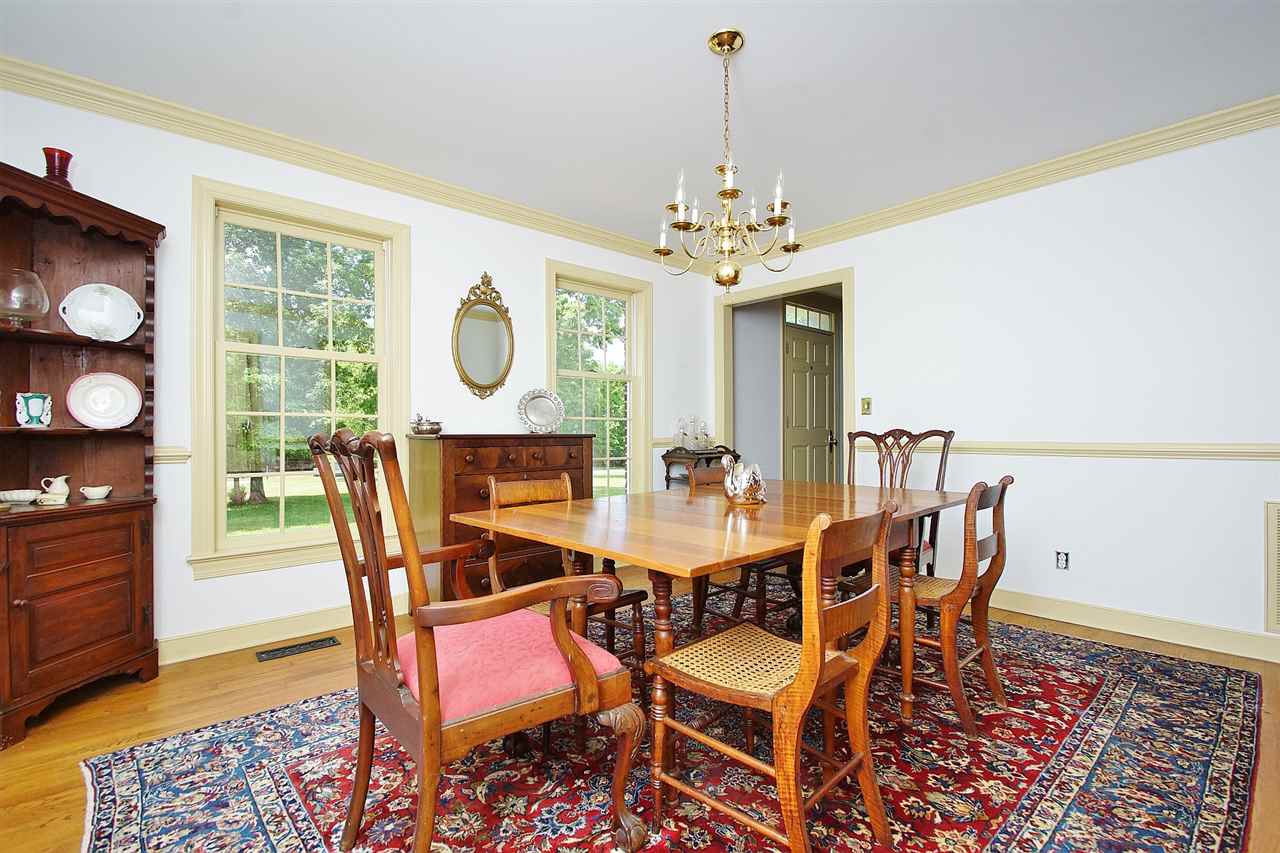 200 Thurman Road Troy, VA 22974 - Photo 11 of 33 with chair rail and crown molding. You can see that a table for 8 or 10 can comfortable fit.