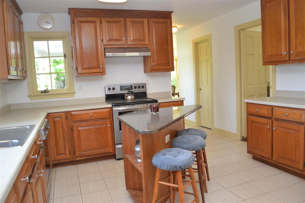 200 Thurman Road Troy, VA 22974 - Photo 12 of 33 with new counter tops and refreshed cabinetry. Granite topped island conveys but is not attached.