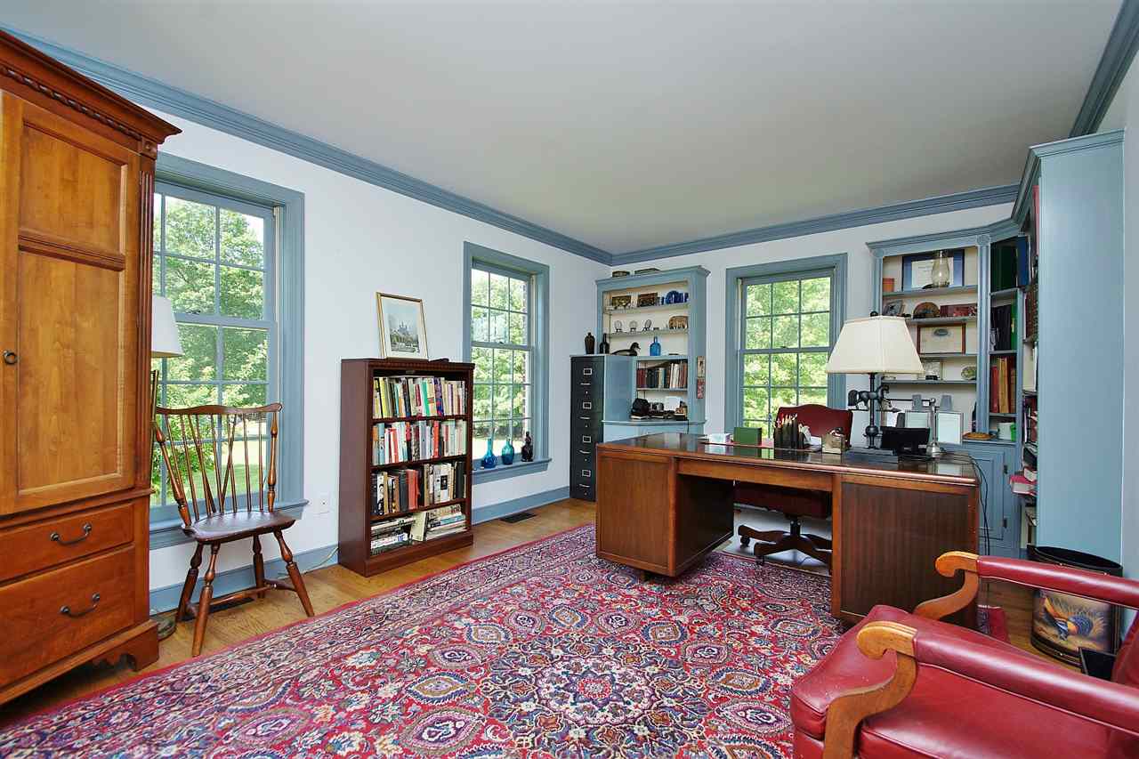 200 Thurman Road Troy, VA 22974 - Photo 17 of 33 on first floor features crown molding and beautiful built-ins including an enclosure for a four drawer file cabinet! The office is privately situated in the master bedroom wing.