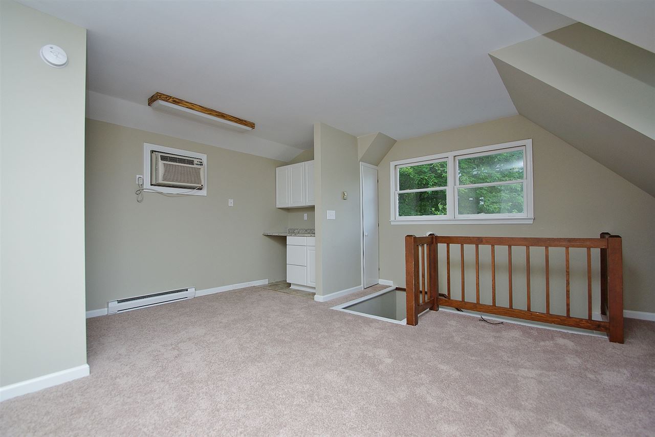 200 Thurman Road Troy, VA 22974 - Photo 22 of 33 Living room, kitchen alcove, bedroom and full bath.