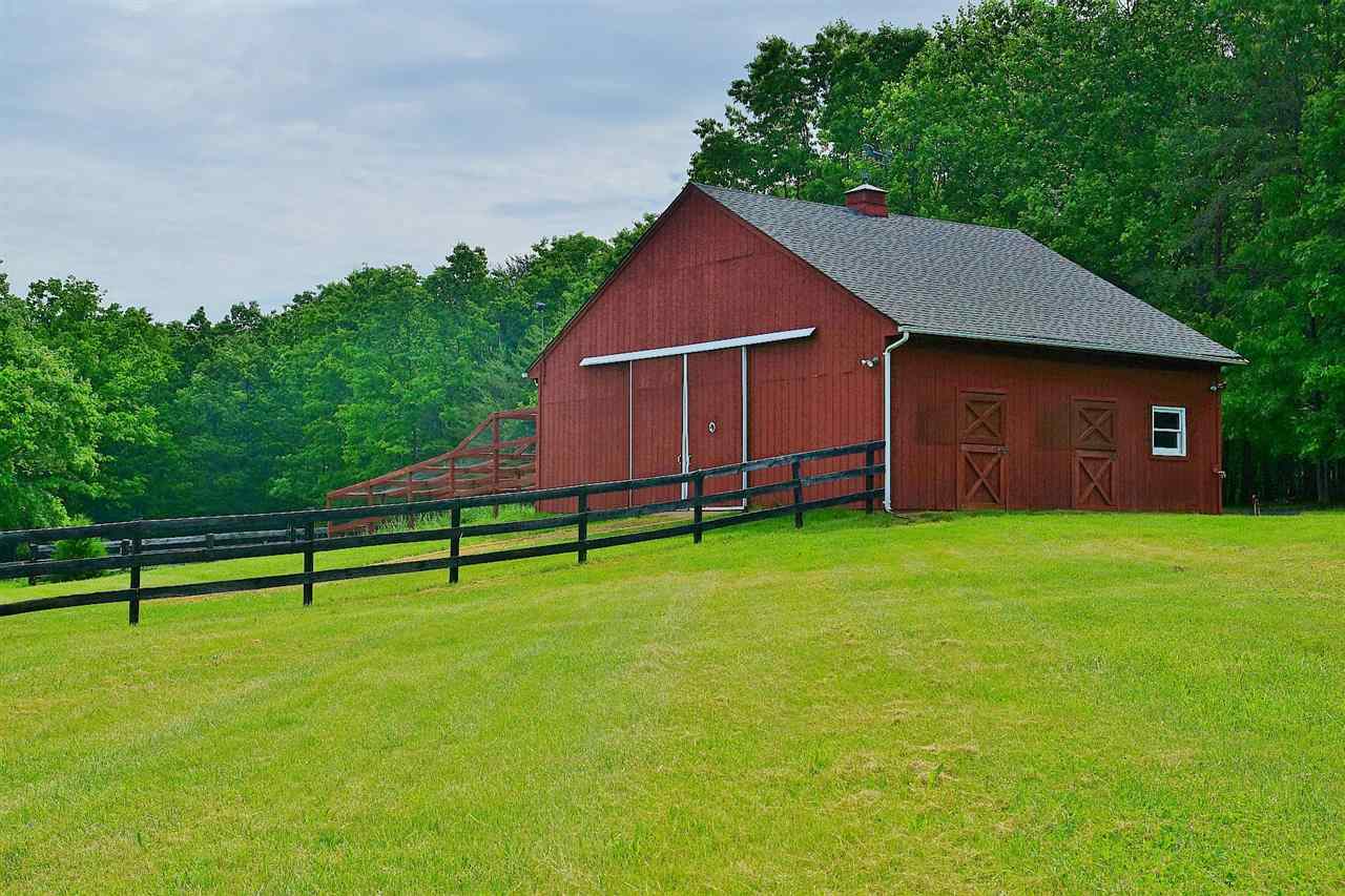 200 Thurman Road Troy, VA 22974 - Photo 3 of 33 with drive through doors at either end, wash and tack bays and hay loft.