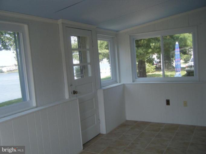 8426 Bay Road Pasadena, MD 21122 - Photo 8 of 16 Sunroom with new ceramic tile
