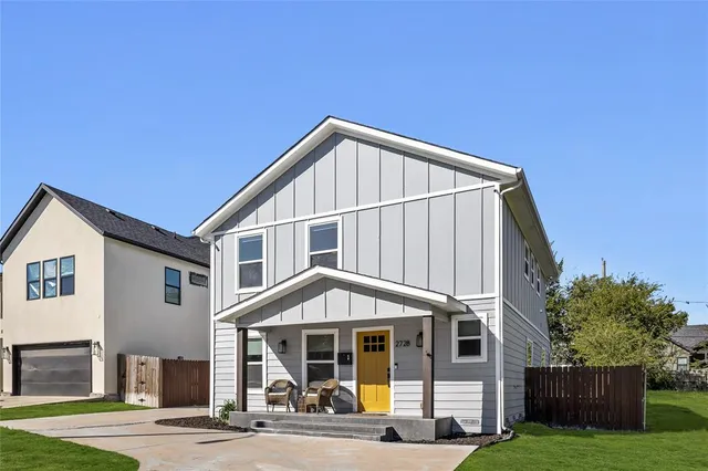 a view of a house with a yard and balcony