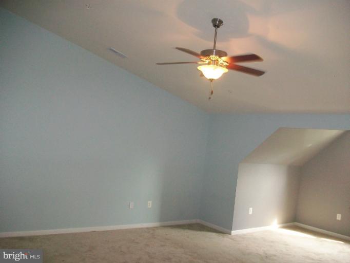 8705 Francesca Drive Clinton, MD 20735 - Photo 2 of 25 a view of a chandelier fan and window