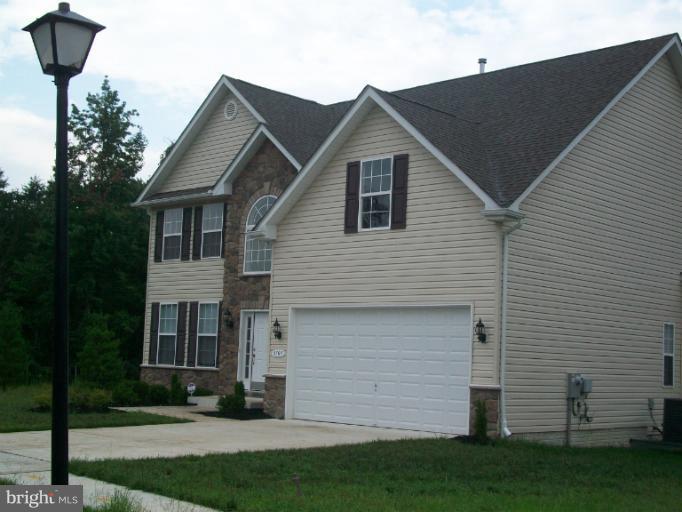 8705 Francesca Drive Clinton, MD 20735 - Photo 11 of 25 a view of a yard in front view of a house