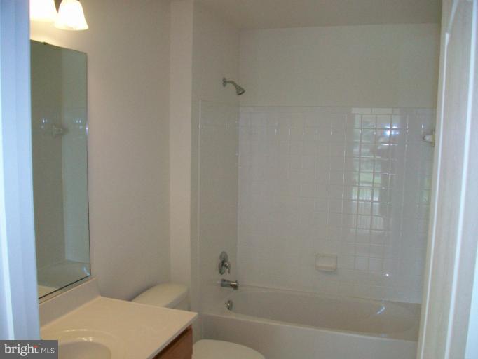 8705 Francesca Drive Clinton, MD 20735 - Photo 12 of 25 a bathroom with a bathtub and shower