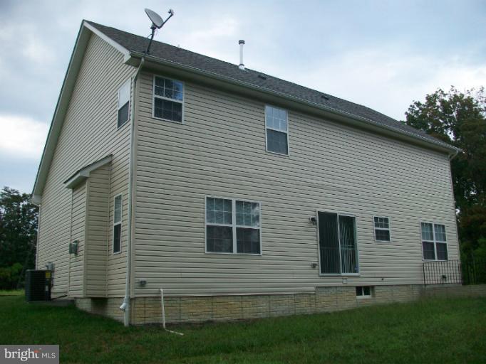 8705 Francesca Drive Clinton, MD 20735 - Photo 14 of 25 a front view of a house with a yard