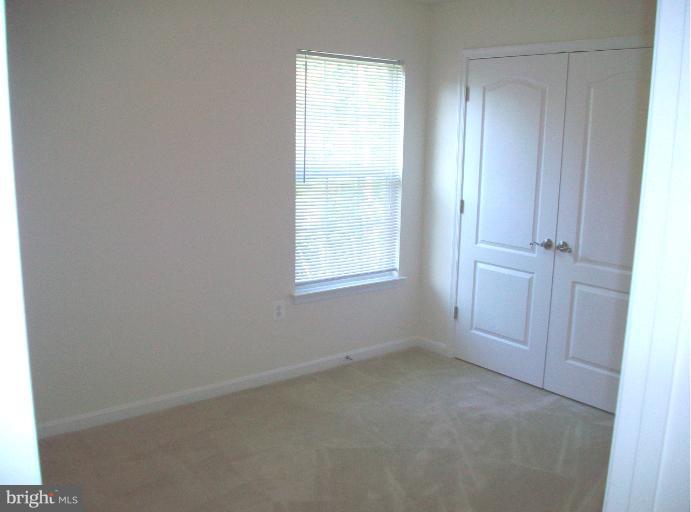 8705 Francesca Drive Clinton, MD 20735 - Photo 18 of 25 an empty room with windows