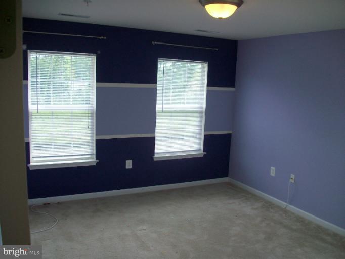 8705 Francesca Drive Clinton, MD 20735 - Photo 9 of 25 a view of an empty room with a window