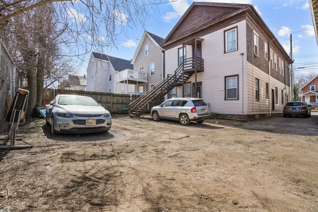 a car parked in front of a house