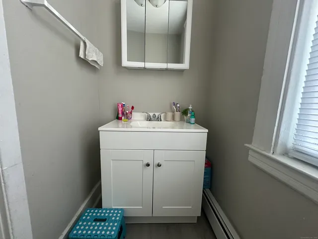 a utility room with sink dryer and washer