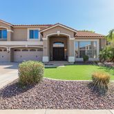 a front view of a house with a yard and porch