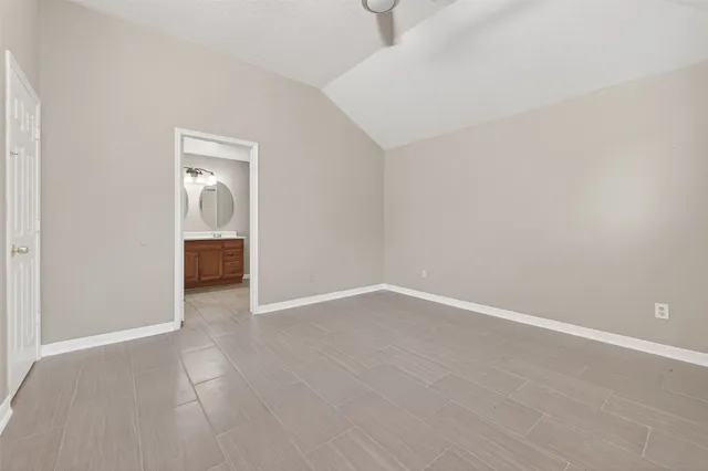 a view of a room with wooden floor and sink