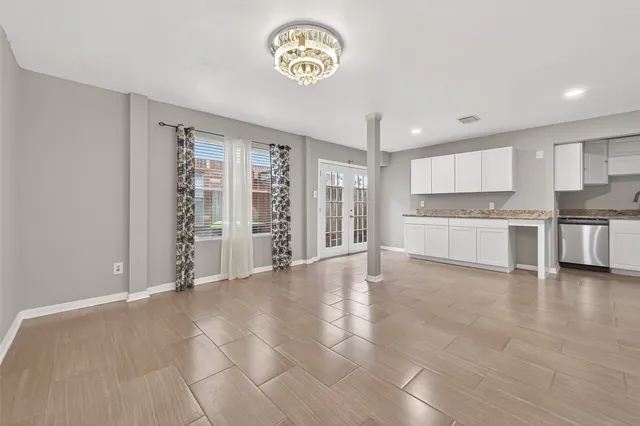 a view of kitchen with a refrigerator cabinets and a counter top space