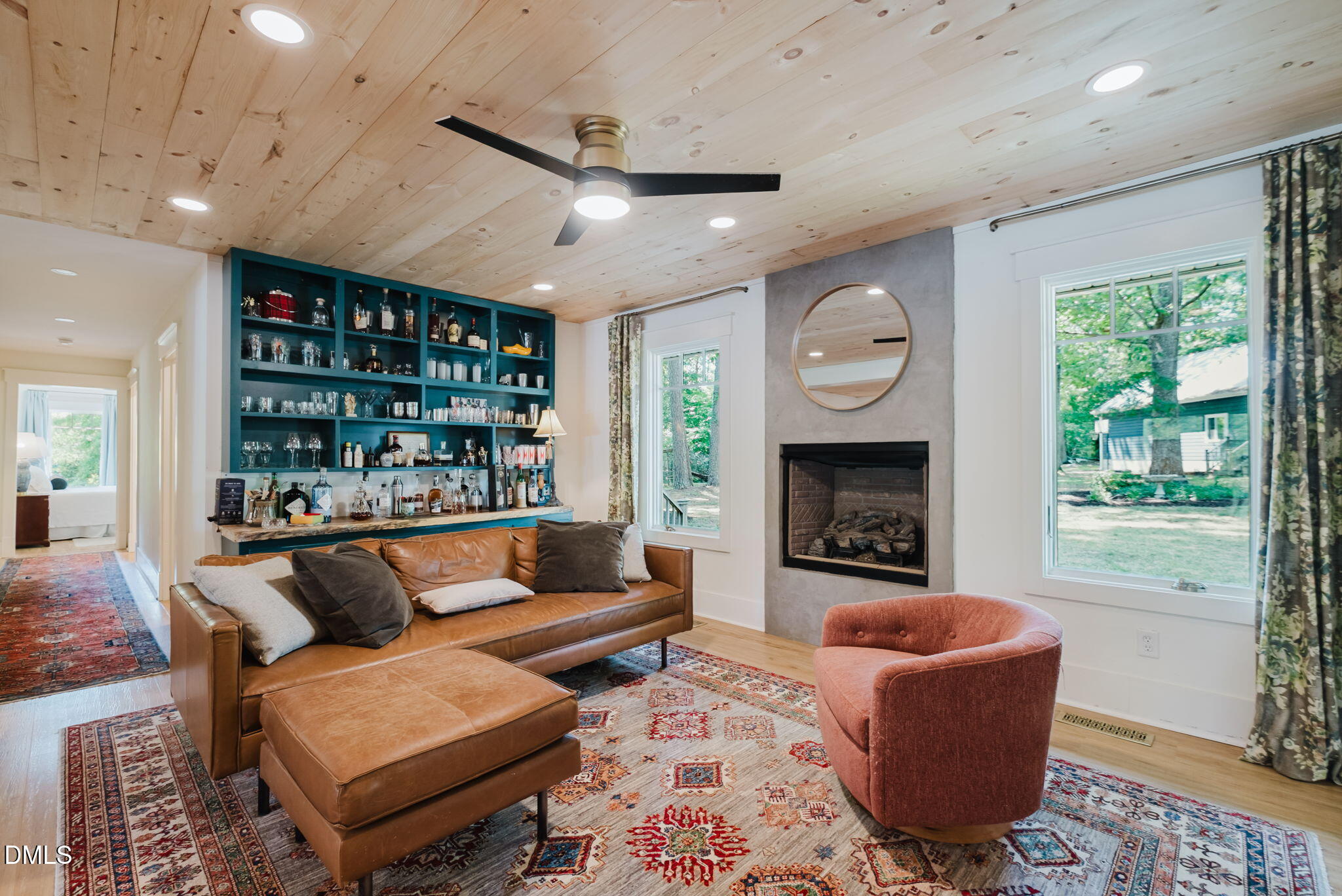 370 Robinson Ferry Road Macon, NC 27551 - Photo 29 of 85 a living room with furniture a fireplace and a large window