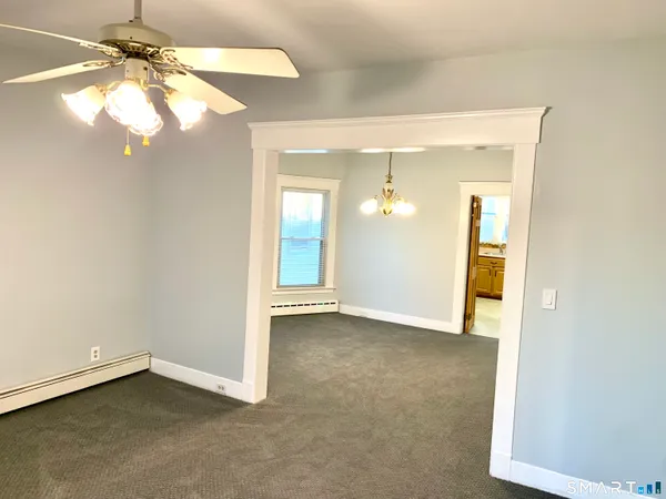 a view of an empty room with a window