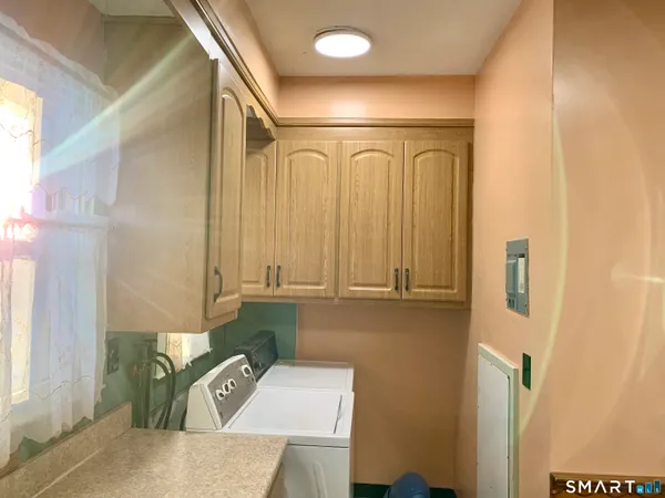 a bathroom with a sink a mirror and a shower