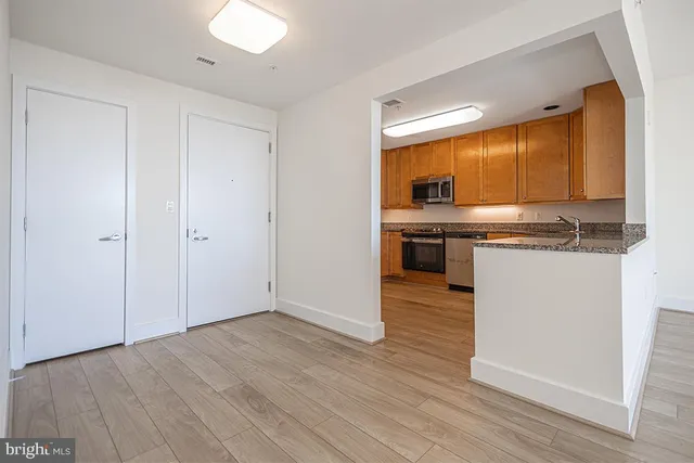 a view of kitchen with wooden floor