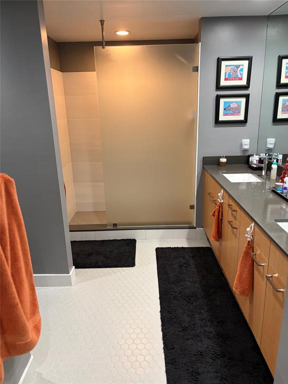 2301 Wilton Drive, Unit R309 Wilton Manors, FL 33305 - Photo 15 of 26 a view of a bathroom with sink and a tub