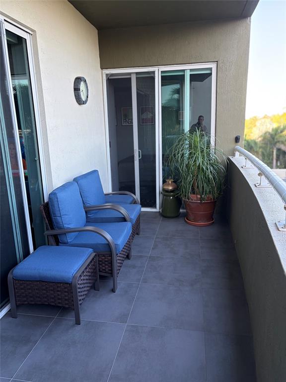 2301 Wilton Drive, Unit R309 Wilton Manors, FL 33305 - Photo 18 of 26 a outdoor living space with furniture and a potted plant