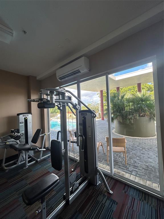 2301 Wilton Drive, Unit R309 Wilton Manors, FL 33305 - Photo 22 of 26 a view of a room with gym equipment