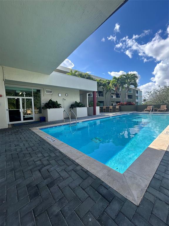2301 Wilton Drive, Unit R309 Wilton Manors, FL 33305 - Photo 24 of 26 a view of a house with swimming pool