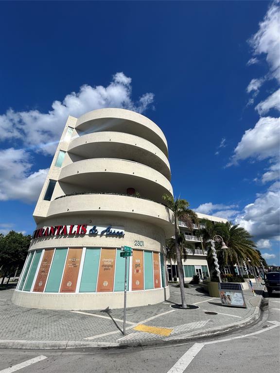 2301 Wilton Drive, Unit R309 Wilton Manors, FL 33305 - Photo 26 of 26 a front view of a building with street
