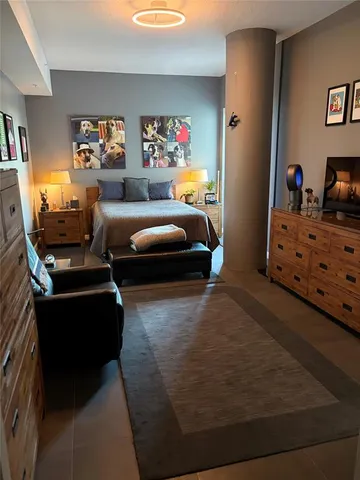 a kitchen with stainless steel appliances a stove a sink and a microwave