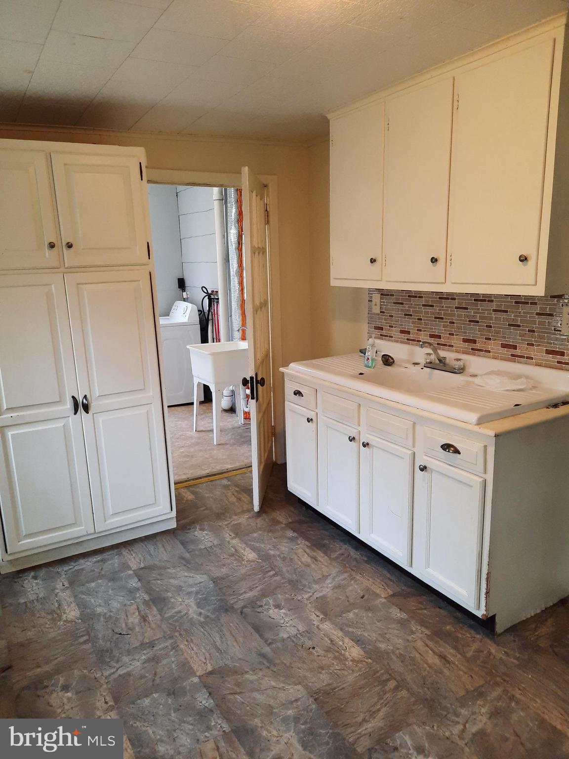 1515 River Road Drumore, PA 17518 - Photo 2 of 13 a view of a kitchen with white cabinets