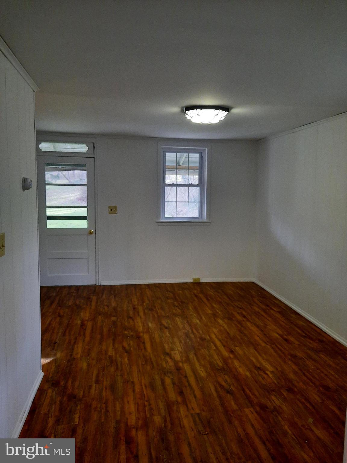1515 River Road Drumore, PA 17518 - Photo 5 of 13 an empty room with wooden floor and windows