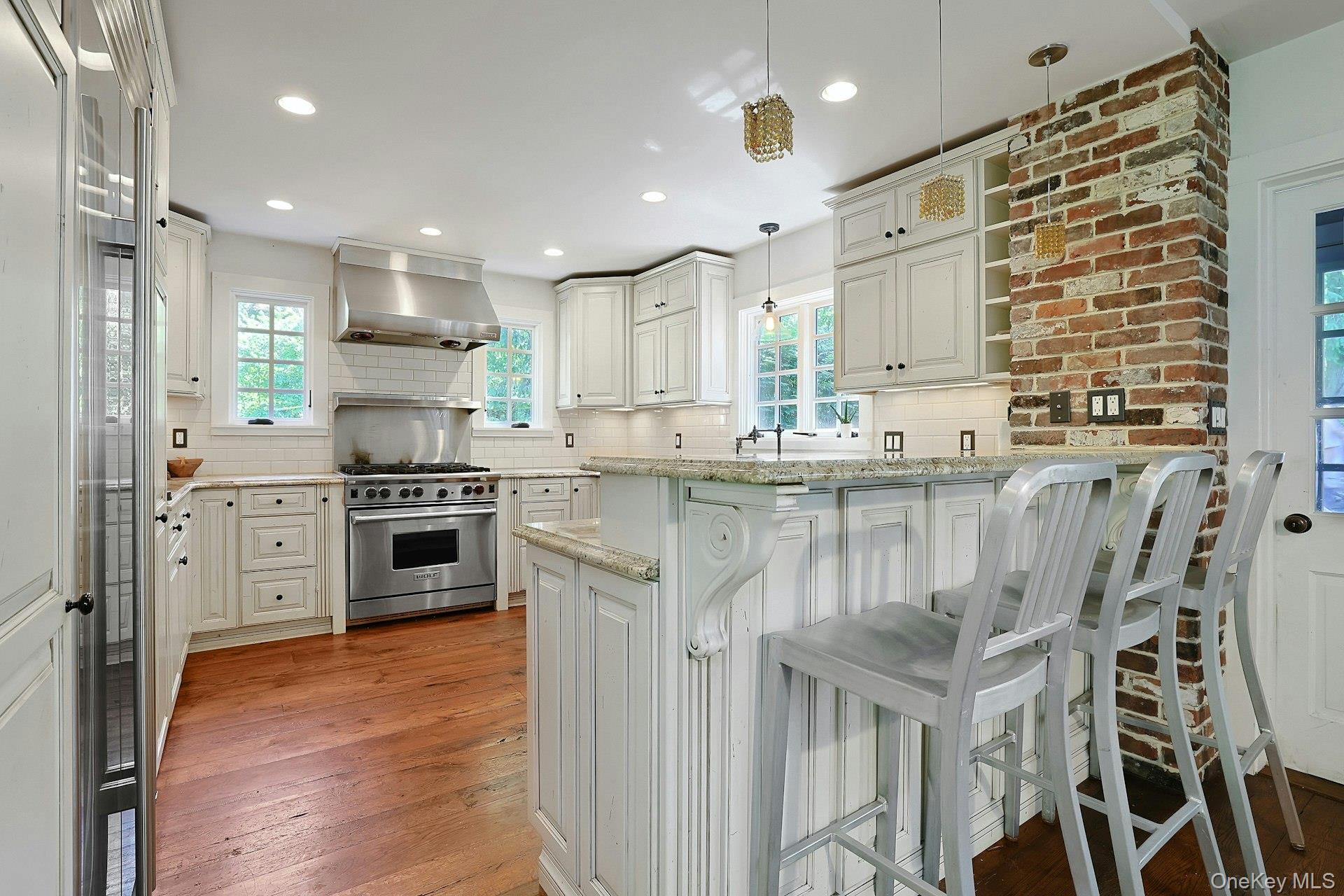 65 Douglas Road Chappaqua, NY 10514 - Photo 18 of 41 The kitchen is more than just a beautiful place to cook. The bar seating area for hanging out with the chef is also a welcoming hub for coffee, conversation, casual meals