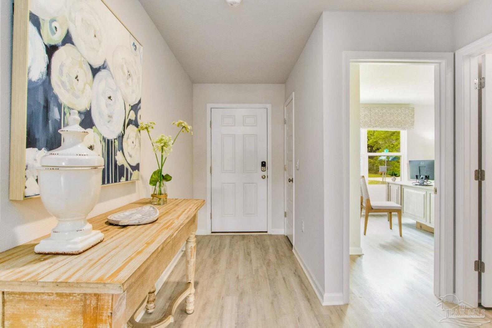 265 Monarch Lane Pensacola, FL 32503 - Photo 4 of 13 a view of a dining room with furniture and wooden floor