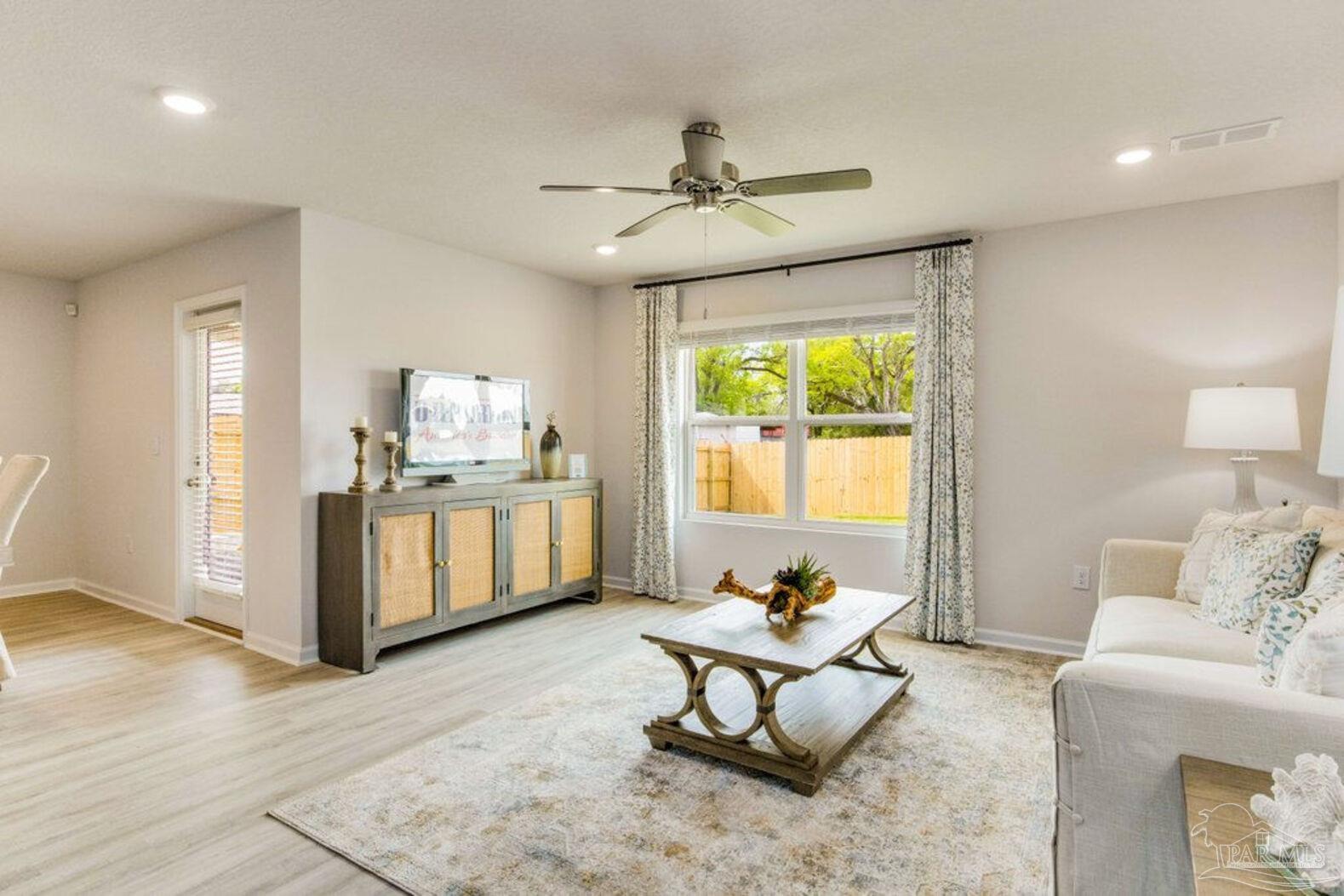 265 Monarch Lane Pensacola, FL 32503 - Photo 7 of 13 a living room with furniture and a window