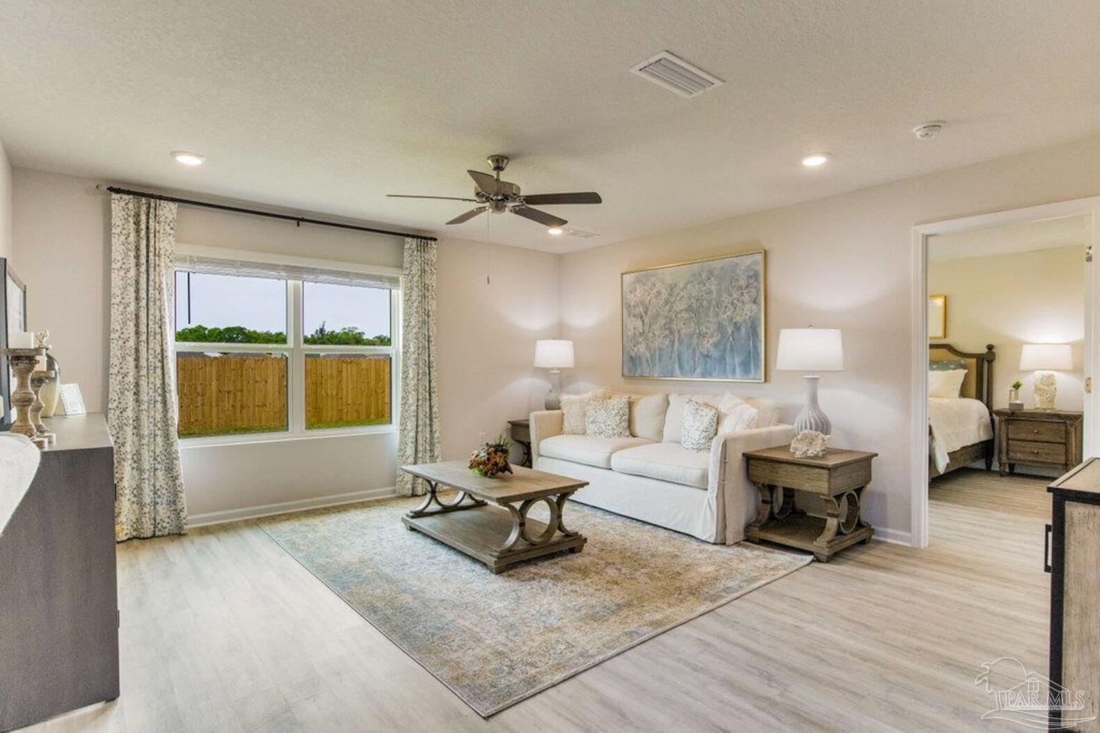 265 Monarch Lane Pensacola, FL 32503 - Photo 8 of 13 a living room with furniture and a window