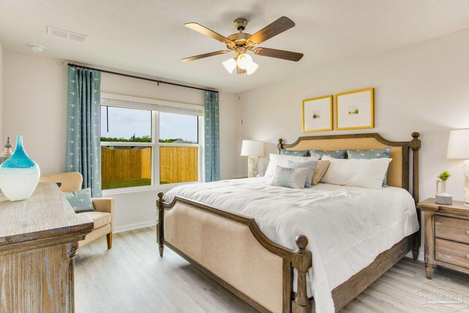 265 Monarch Lane Pensacola, FL 32503 - Photo 9 of 13 a spacious bedroom with a bed and window