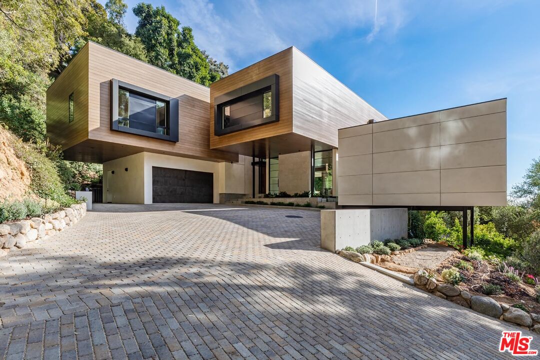 a front view of a house with yard