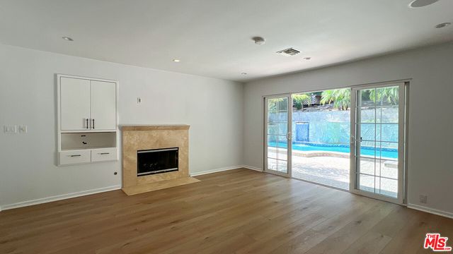 a bathroom with a sink vanity and a mirror