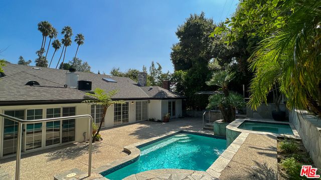 a view of a garden with a fountain