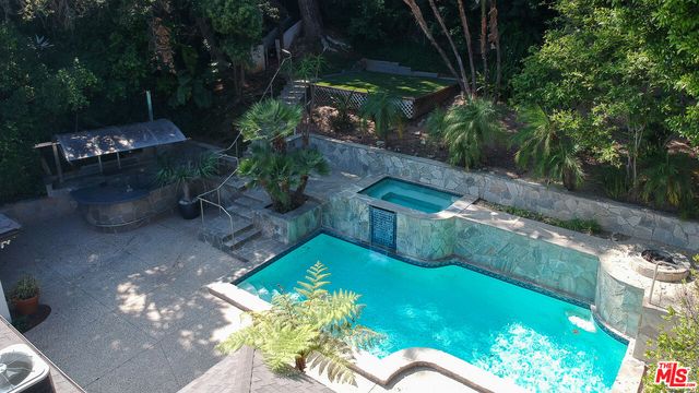 a view of a swimming pool with a patio