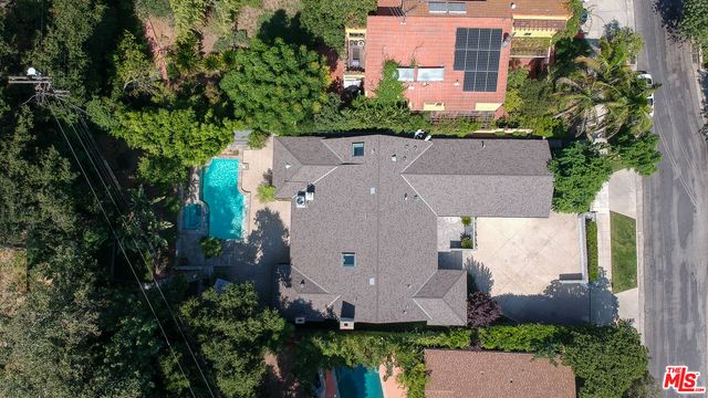 an aerial view of house with yard