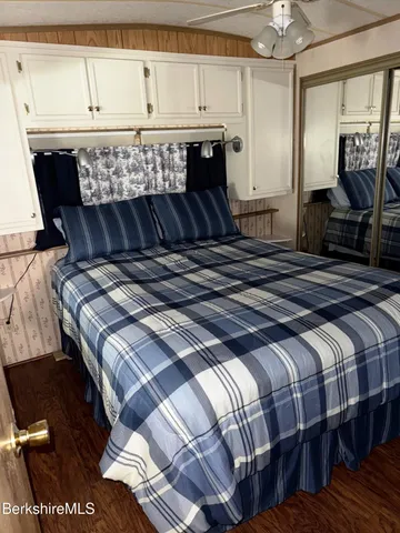 a living room with blue lights with furniture