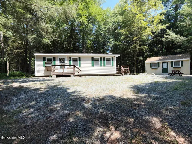 a house view with a garden space