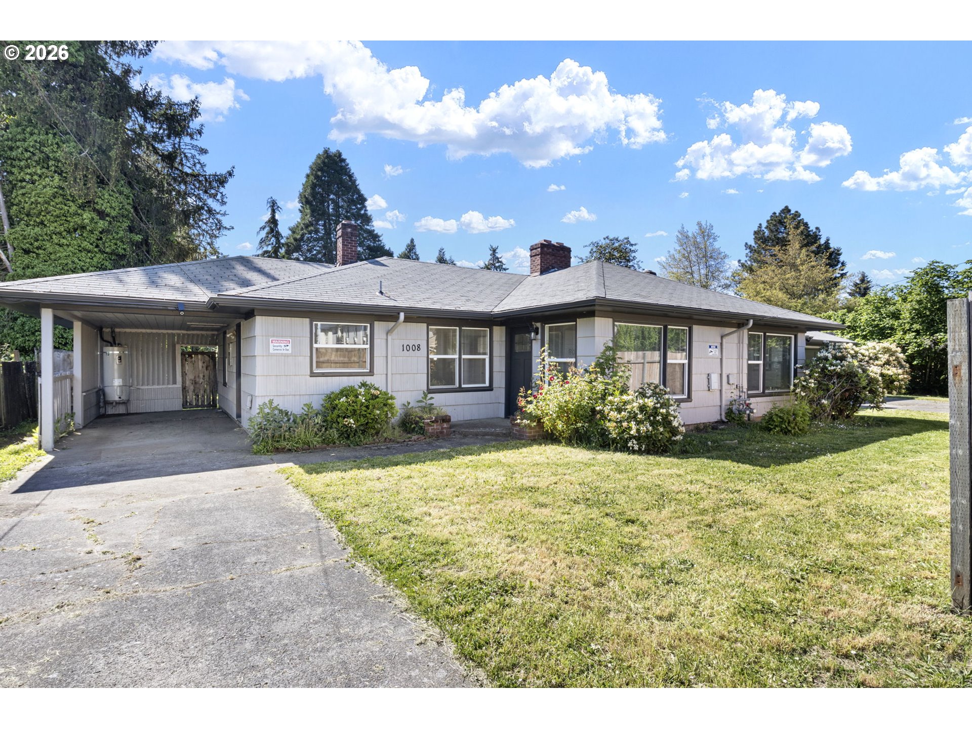 1008 Coburg Road Eugene, OR 97401 - Photo 4 of 46 a front view of a house with a yard