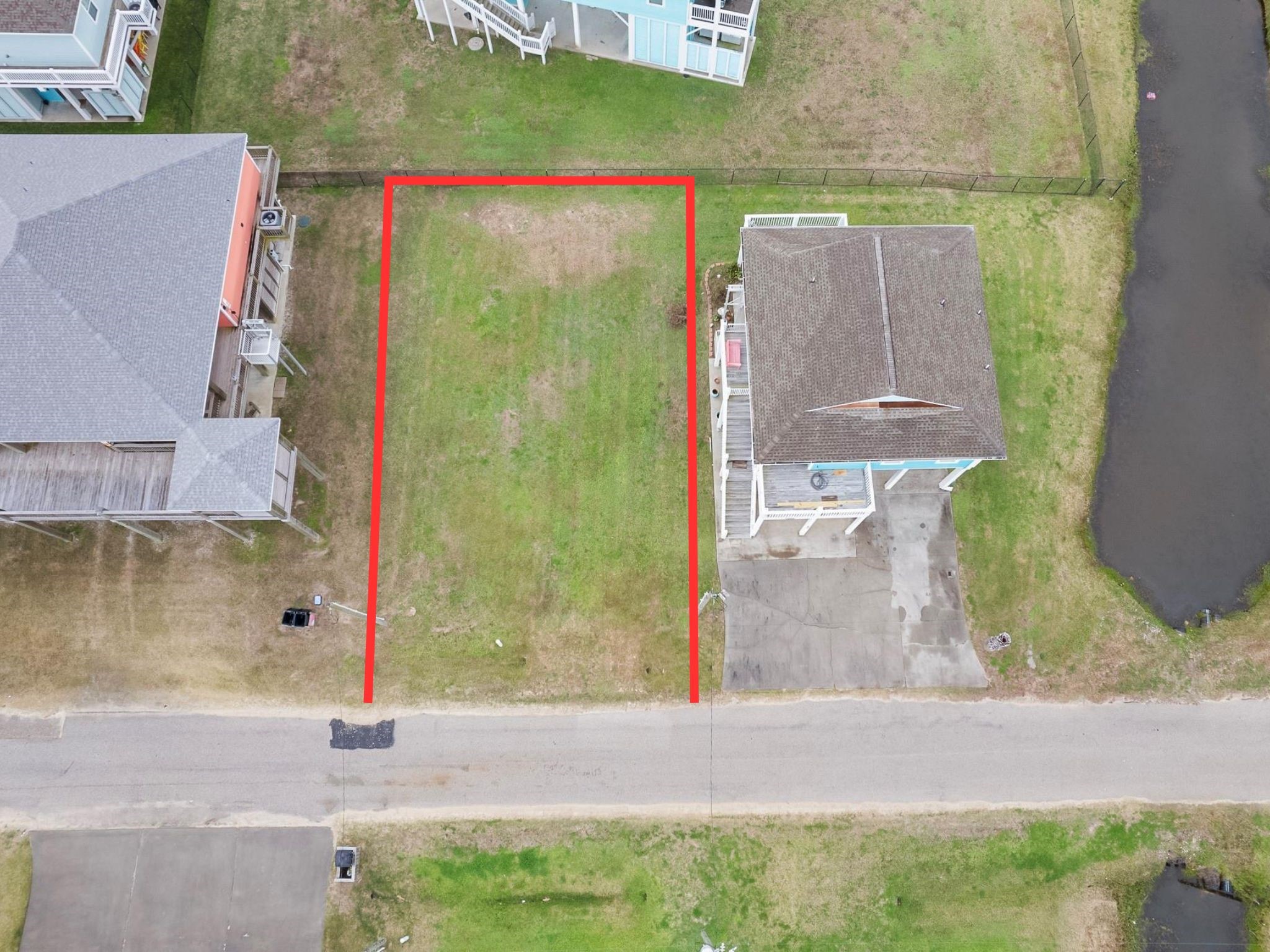 933 Clara Street Port Bolivar, TX 77650 - Photo 2 of 3 a small white building with a view of the back yard