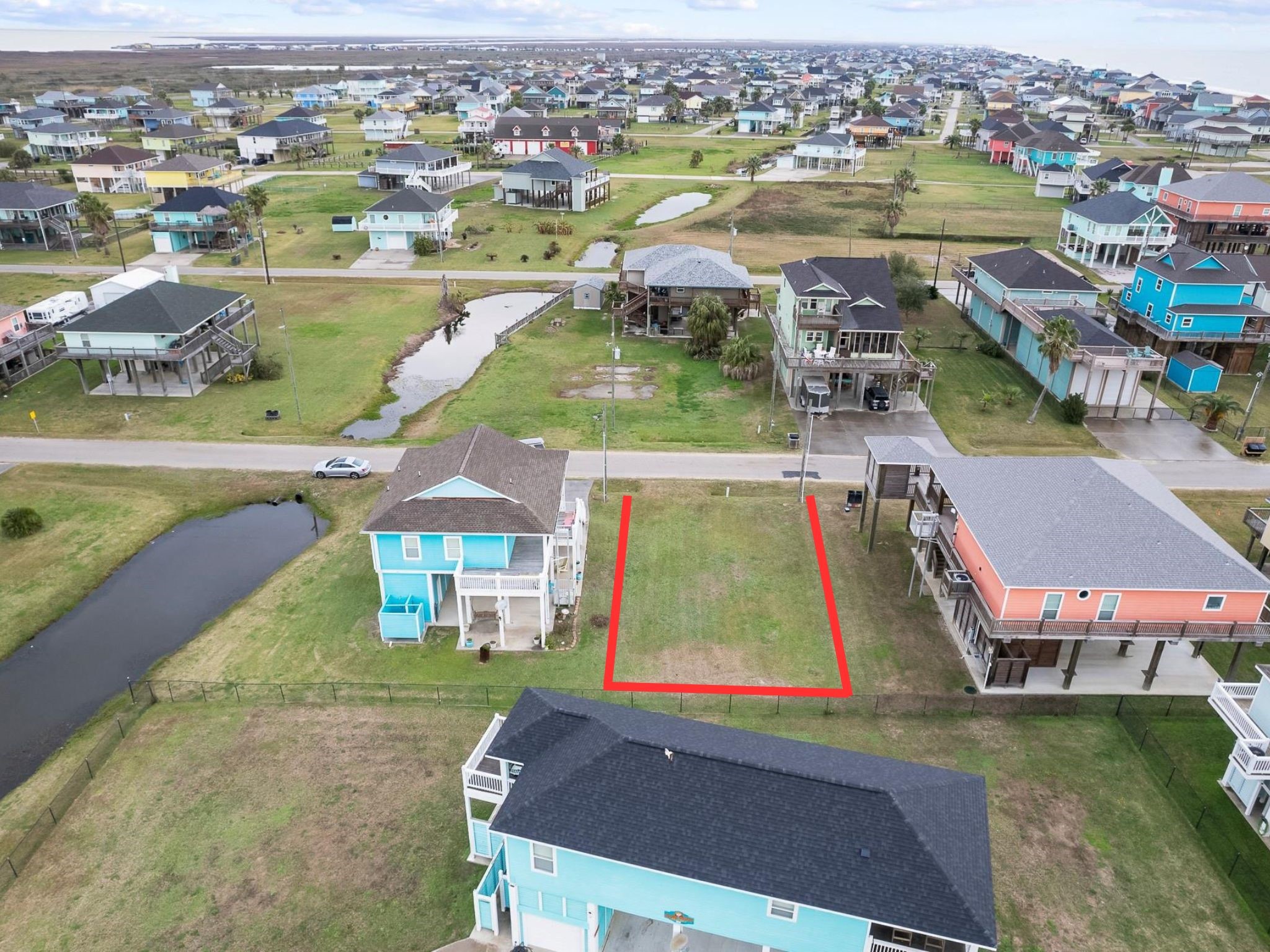 933 Clara Street Port Bolivar, TX 77650 - Photo 3 of 3 an aerial view of a house with a lake view