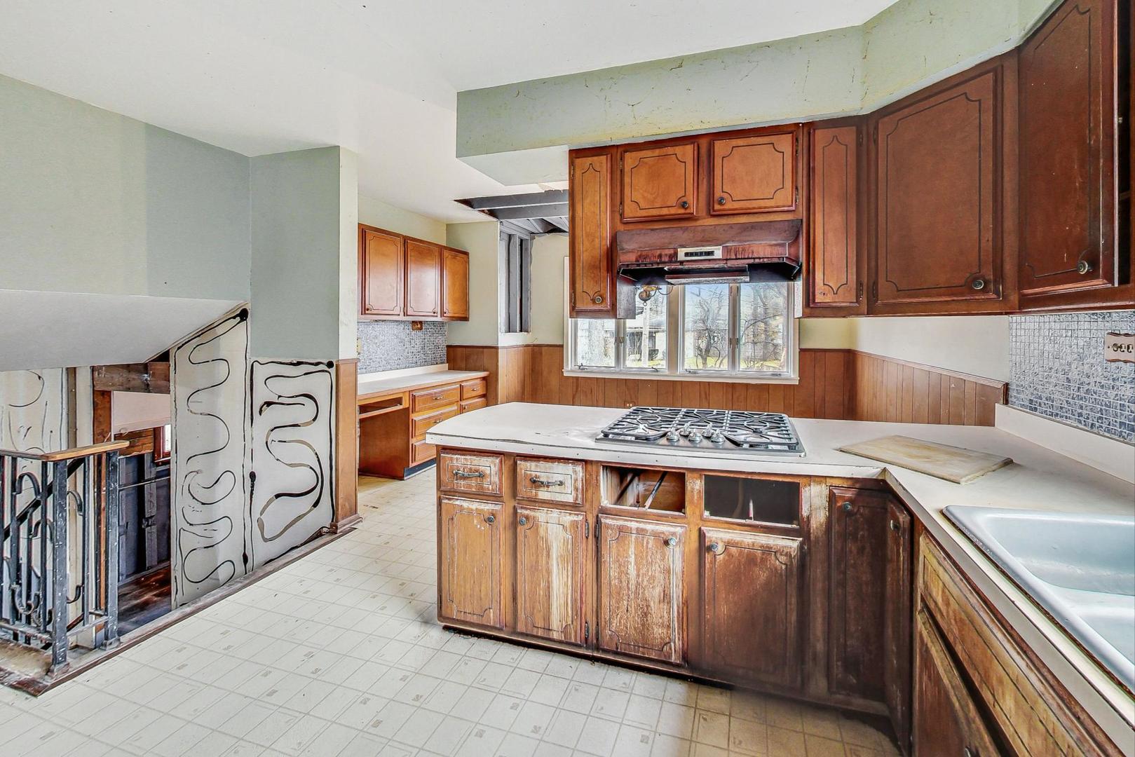 771 Ridge Road Highland Park, IL 60035 - Photo 14 of 54 a kitchen that has a sink and a stove