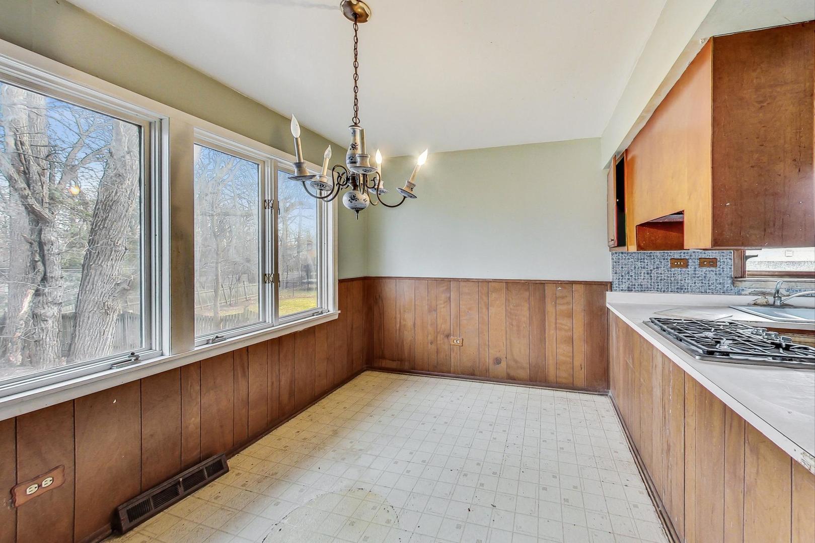 771 Ridge Road Highland Park, IL 60035 - Photo 17 of 54 a view of kitchen with granite countertop cabinets and outdoor view