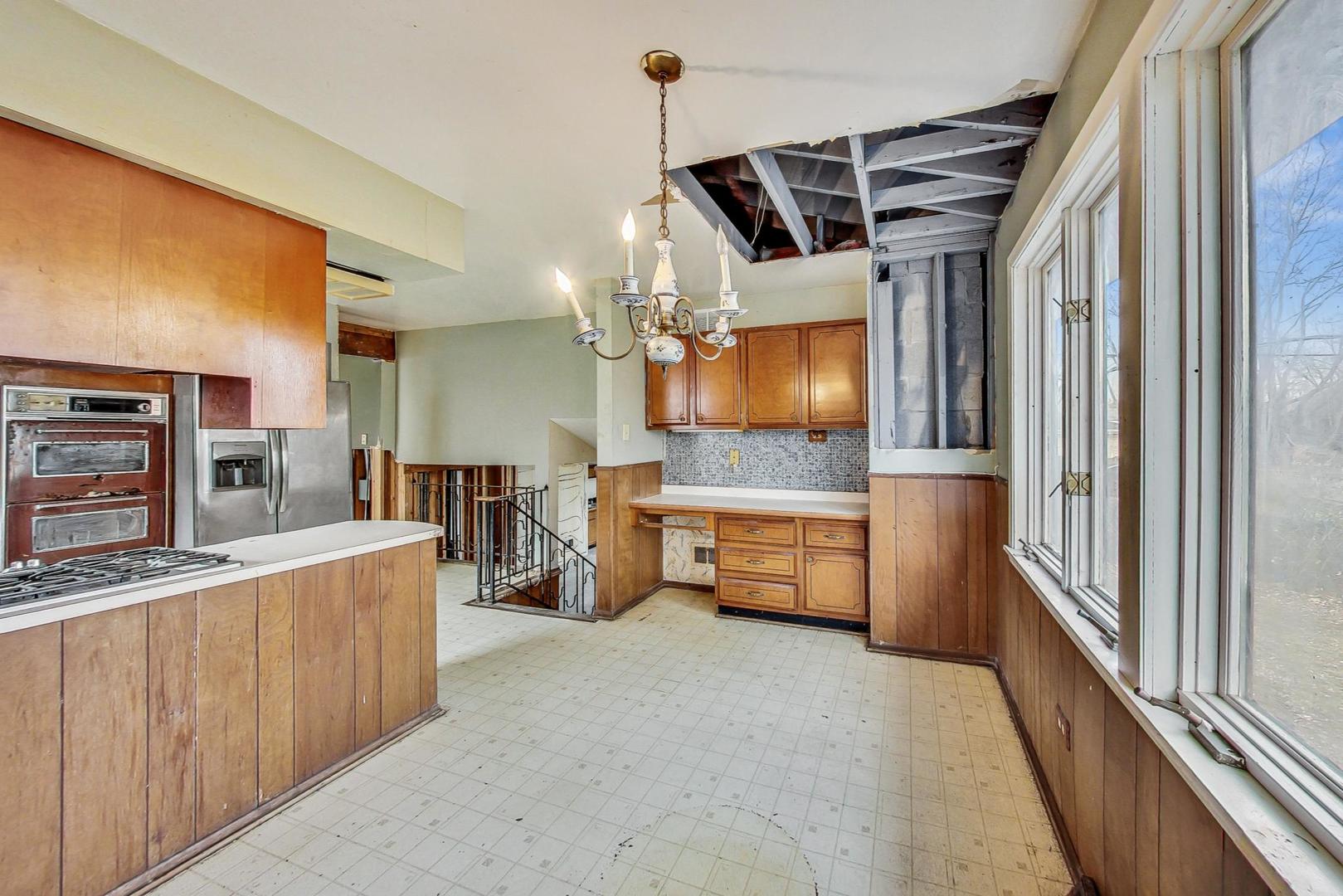 771 Ridge Road Highland Park, IL 60035 - Photo 18 of 54 a kitchen that has a lot of cabinets and wooden floor