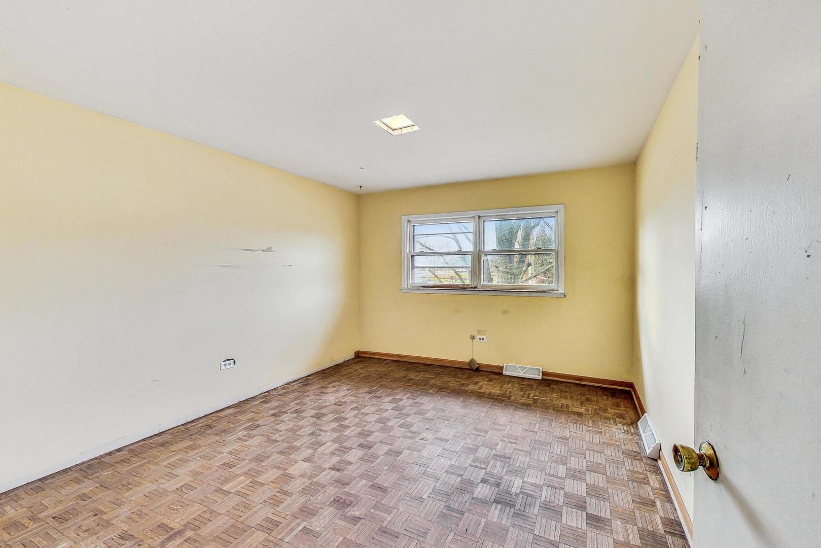 771 Ridge Road Highland Park, IL 60035 - Photo 31 of 54 an empty room with a empty space and wooden floor