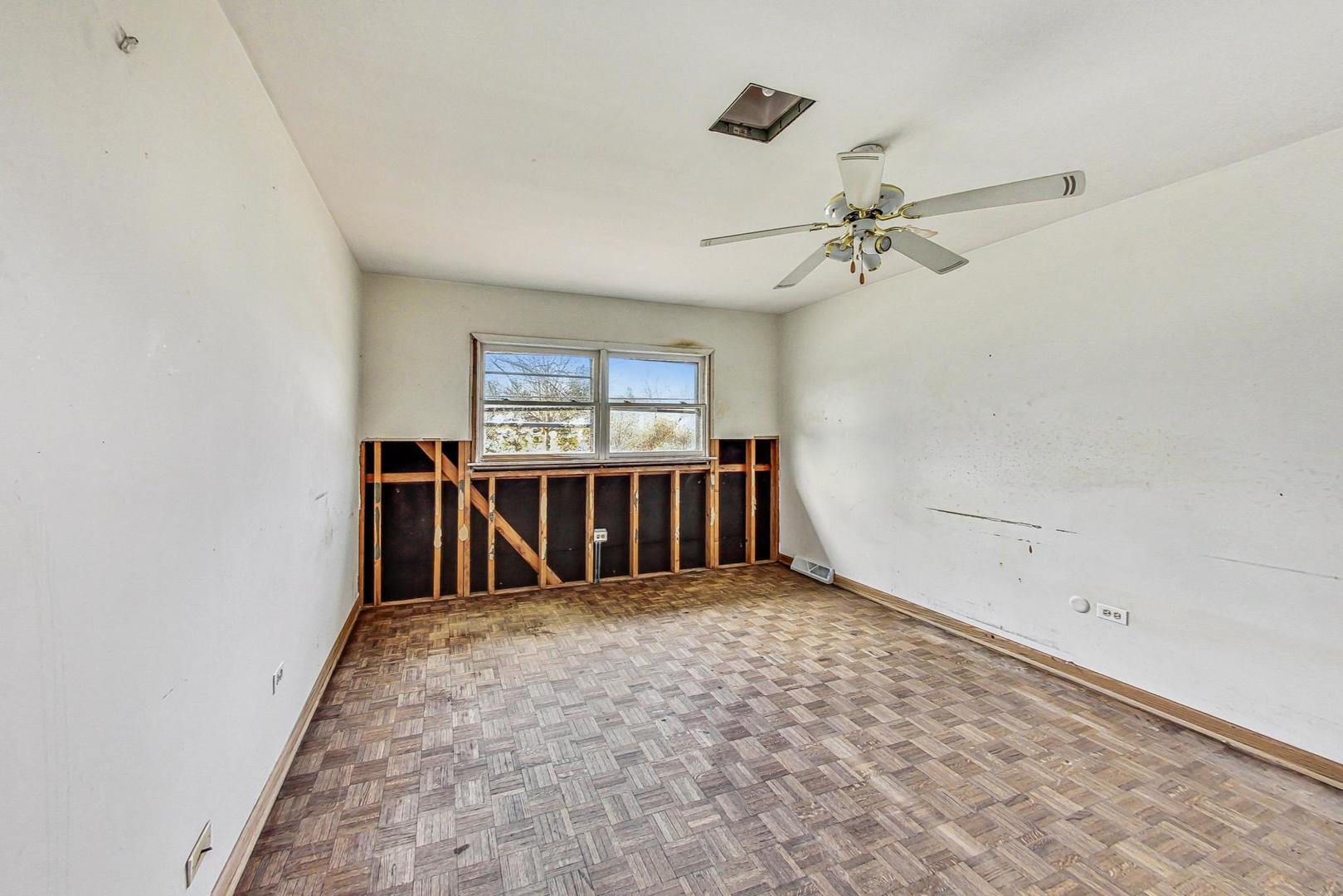 771 Ridge Road Highland Park, IL 60035 - Photo 34 of 54 an empty room with windows and ceiling fan